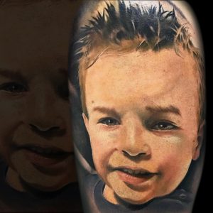 tatuagem rosto filho
